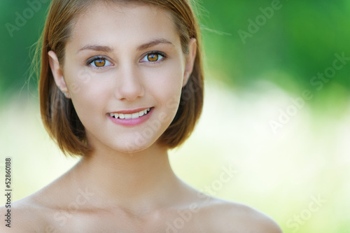 Photo: smiling beautiful young woman close up smiling beautiful young woman close up