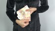 Video: black shirt woman offering banknotes black shirt woman offering banknotes