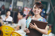 Waitress chinese girl of restaurant with menu