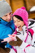 Photo: Close up of man giving present to woman outdoors Close up of man giving present to woman outdoors