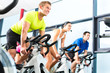 Photo: group doing sport Spinning in the gym for fitness group doing sport Spinning in the gym for fitness