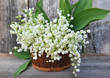 canvas print picture - Basket with lilies of the valley (Convallaria majalis)