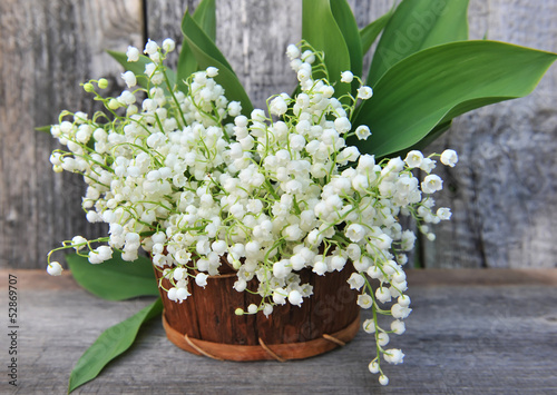 Photo: Basket with lilies of the valley (Convallaria majalis) Basket with lilies of the valley (Convallaria majalis)