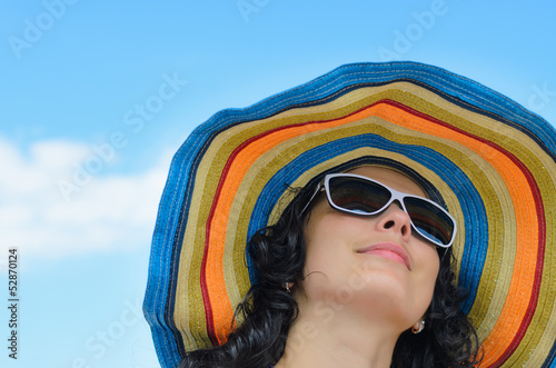 Photo: Beautiful woman in a wide brimmed sunhat Beautiful woman in a wide brimmed sunhat