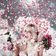 Tender woman with flowers. Romantic celebration