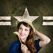 Photo: Cute military pin-up woman on army star background Cute military pin-up woman on army star background
