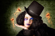 Stylish female magician performing magic trick