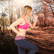Photo: Fitness woman running in forest location Fitness woman running in forest location
