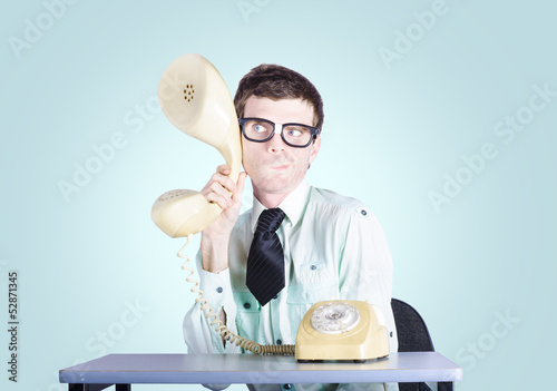 Photo: Male business spy conducting competitor analysis Male business spy conducting competitor analysis