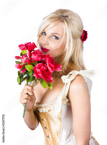 Photo: Adorable florist woman smelling red flowers Adorable florist woman smelling red flowers