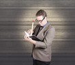 Male administration clerk writing diary notes