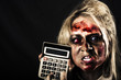 Business woman with calculator. Halloween sale