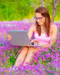 Cute woman with laptop outdoors