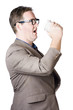 Dork man consuming hot drink in haste. Coffee rush