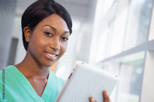 Photo: Nurse with tablet computer Nurse with tablet computer