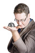 Hotel concierge holding help desk service bell