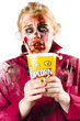 Zombie woman watching scary movie with popcorn