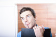 Thinking business man with diary and pen