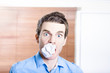 Stressed male office employee eating big workload