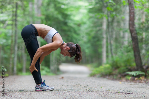 Photo: Middle aged woman stretching Middle aged woman stretching