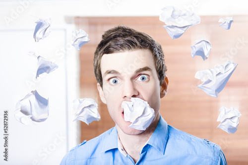 Photo: Stressed office employee crazy paper work Stressed office employee crazy paper work