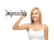 Photo: woman writing the word (im)possible in the air woman writing the word (im)possible in the air