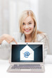 woman with laptop pointing at email sign