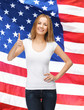 Photo: teenage girl in blank white t-shirt with thumbs up teenage girl in blank white t-shirt with thumbs up