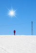 man with cross-country skiing up the hill