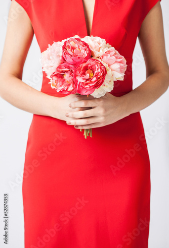Photo: woman hands with bouquet of flowers woman hands with bouquet of flowers