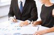 business team on meeting discussing graphics