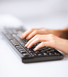 woman hands typing on keyboard