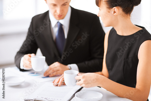 Photo: woman hand signing contract paper woman hand signing contract paper