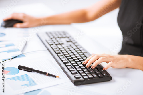 Photo: woman hands typing on keyboard woman hands typing on keyboard