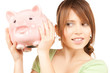 lovely girl with big piggy bank