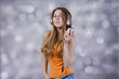 Girl with music player at light background