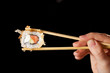 Sushi with chopsticks