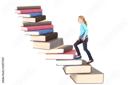 Photo: child climbing staircase of books child climbing staircase of books