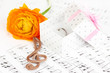 Treble clef, flower and box holding wedding ring