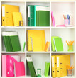 White office shelves with different stationery, close up
