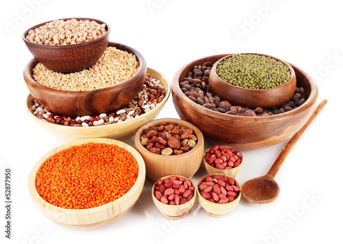 Photo: Different kinds of beans in bowls isolated on white Different kinds of beans in bowls isolated on white