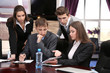Photo: Business people working in conference room Business people working in conference room