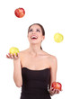 Smiling woman with apple isolated on white