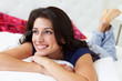 Photo: Woman Relaxing In Bed Wearing Pajamas Woman Relaxing In Bed Wearing Pajamas