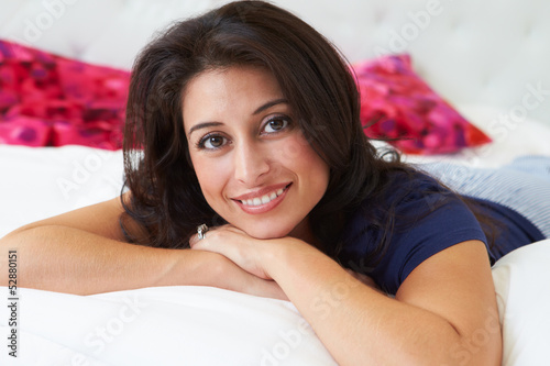 Photo: Woman Relaxing In Bed Wearing Pajamas Woman Relaxing In Bed Wearing Pajamas
