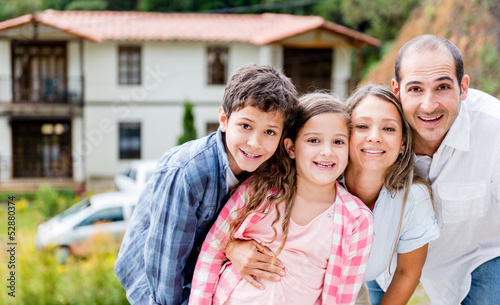 Photo: Family outside their house Family outside their house