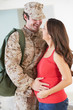 Photo: Pregnant Wife Greeting Military Mother Home On Leave Pregnant Wife Greeting Military Mother Home On Leave
