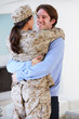 Husband Greeting Military Wife Home On Leave