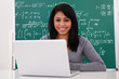 Portrait Of Female Student Using Laptop
