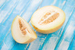 Photo: Sliced Galia melon on wooden boards, horizontal shot Sliced Galia melon on wooden boards, horizontal shot